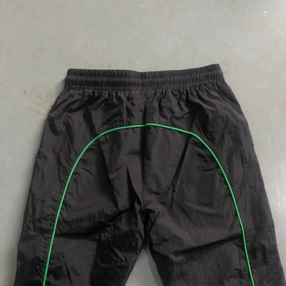 Conjunto Trapstar Shellsuit “Black Green”