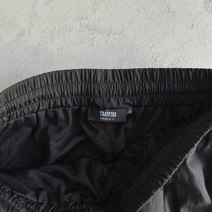 Conjunto Trapstar Football Shellsuit “Black”