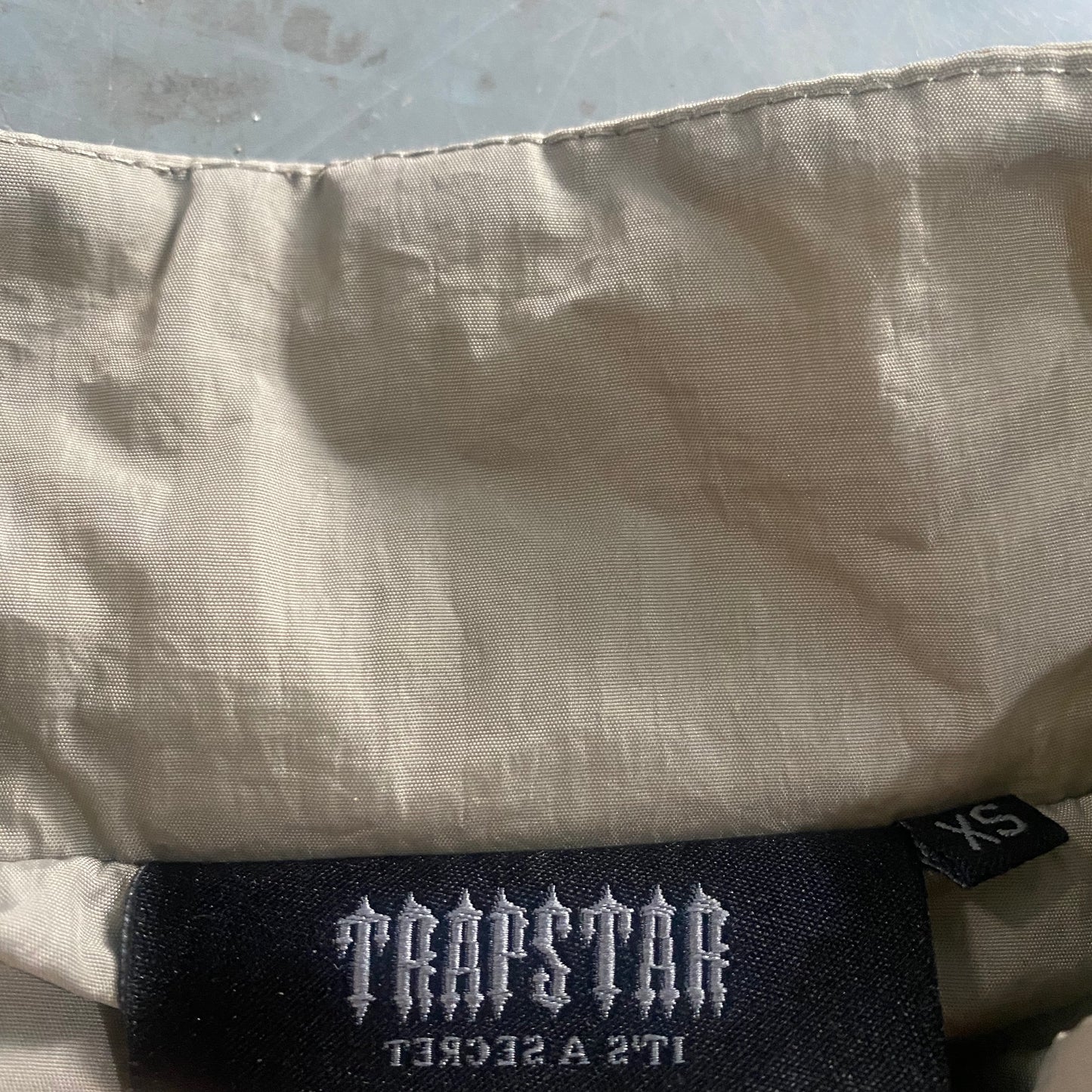 Conjunto Trapstar Shellsuit “Beige”