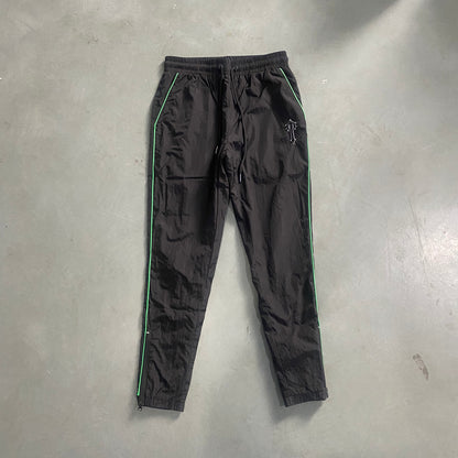 Conjunto Trapstar Shellsuit “Black Green”