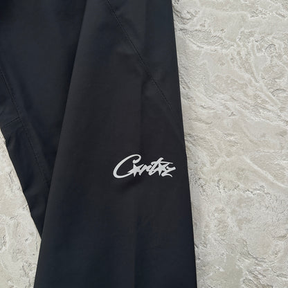 Corteiz Elitework Waterproof Shell Pants “Black”