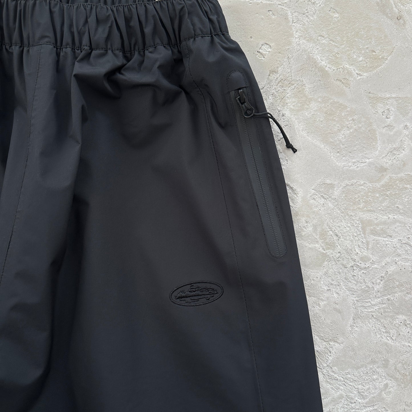 Corteiz Elitework Waterproof Shell Pants “Black”