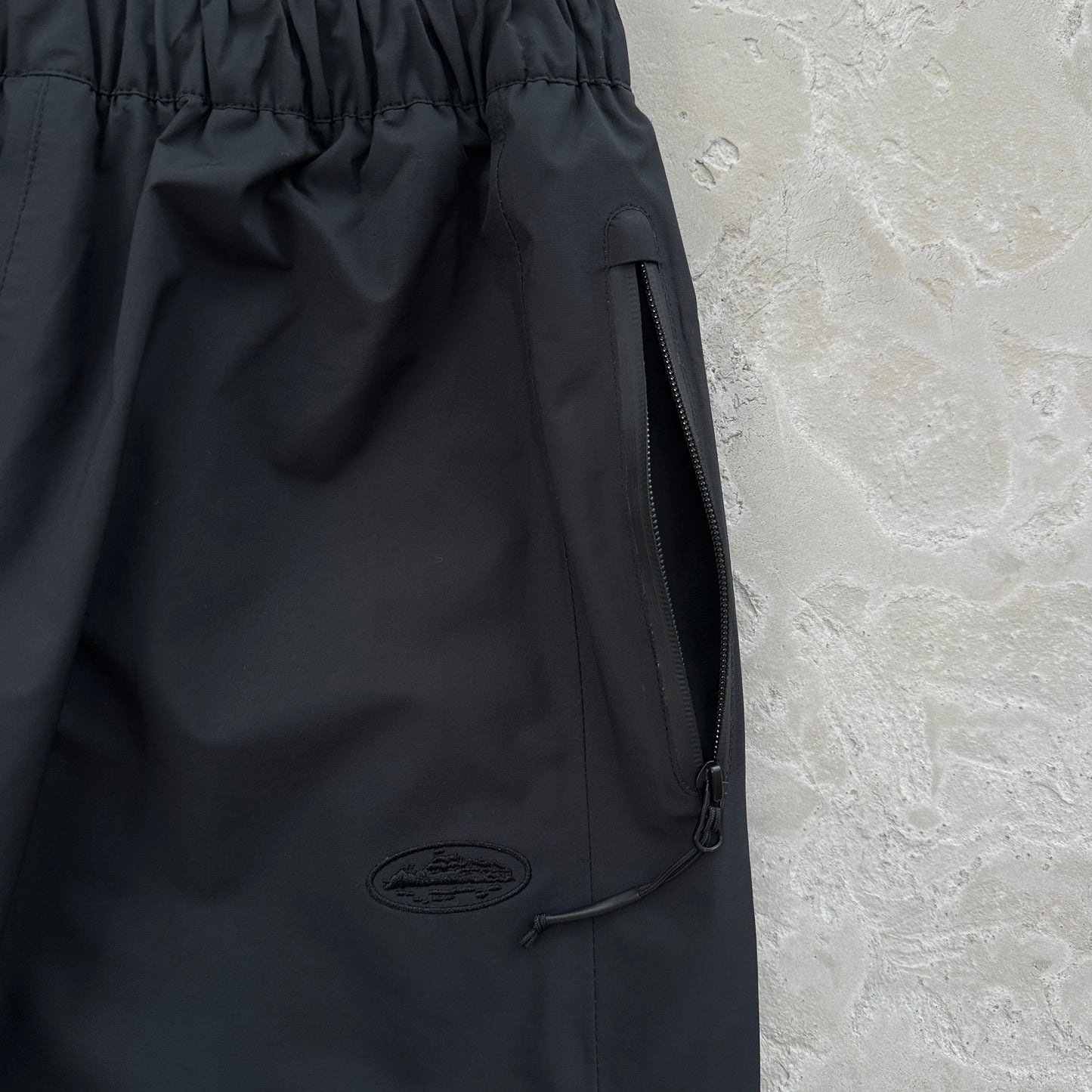 Corteiz Elitework Waterproof Shell Pants “Black”