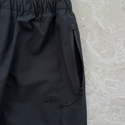 Corteiz Elitework Waterproof Shell Pants “Black”