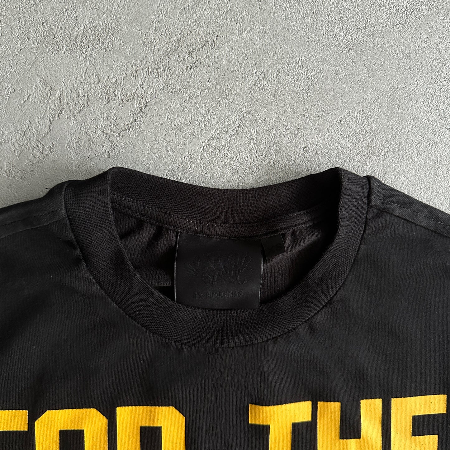 Syna World Wages Tee “Black”