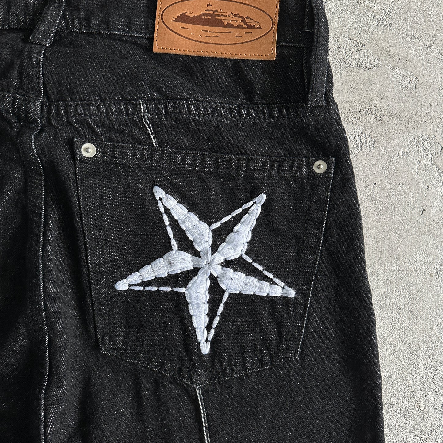 Corteiz Star Denim Pants “Dark White”